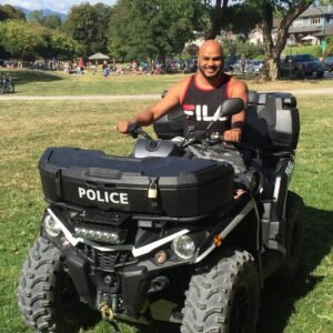 Surindra Sugrim on a police vehicle