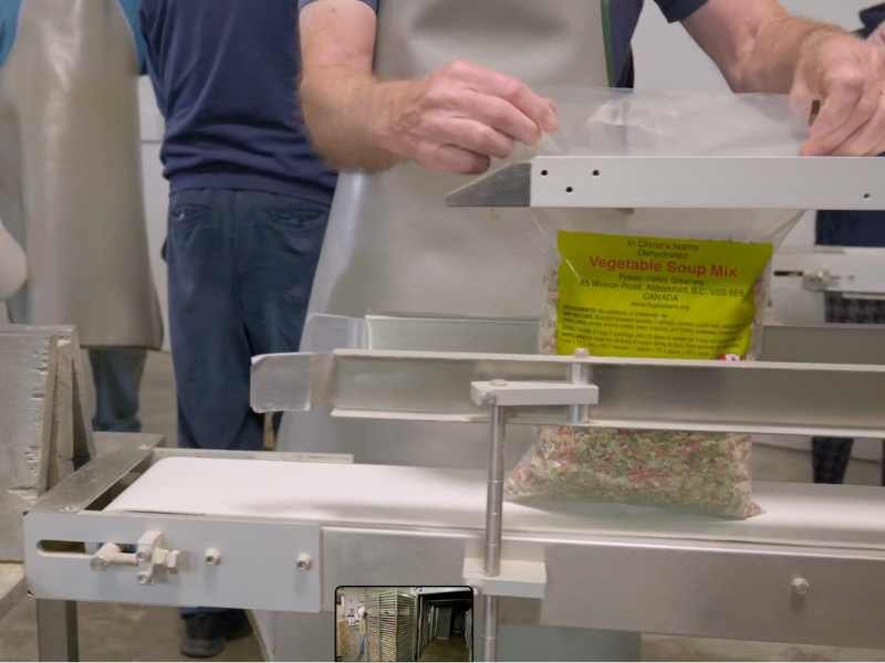 Dehydrated vegetables being packed into soup mix.