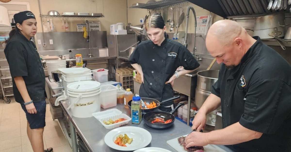 Youth learning culinary skills with recovered food at Dan's Diner