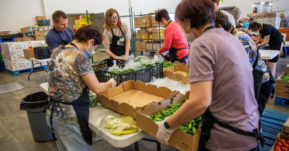 Volunteers packing food donations.