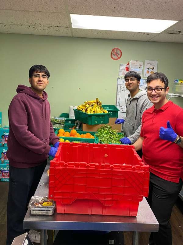 1 Archway food bank volunteers sorting food.