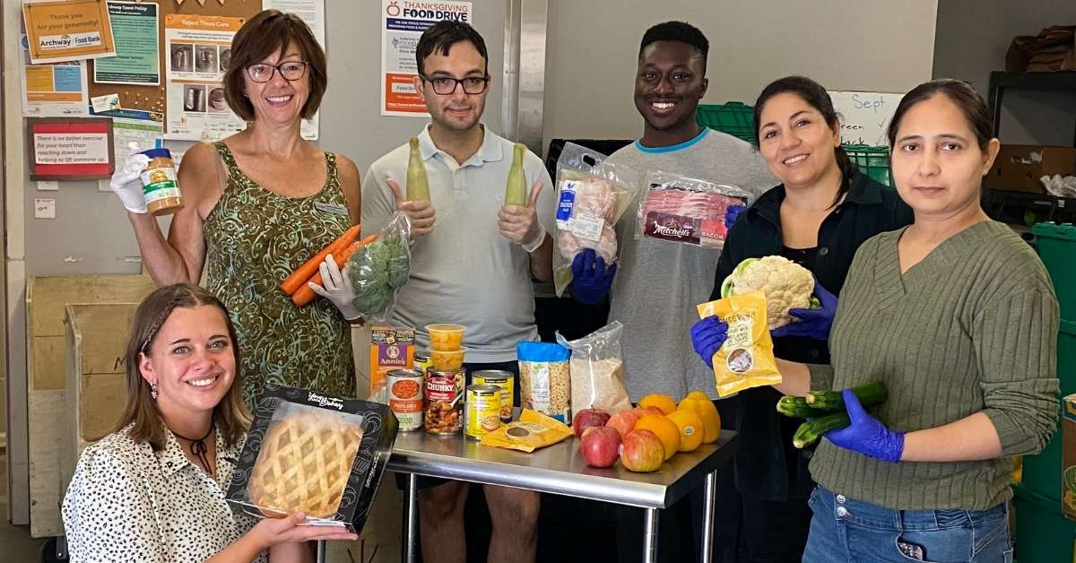 Archway food bank volunteers sorting food donations.